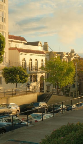 Warm golden-hour light on a San Francisco street with historic architecture