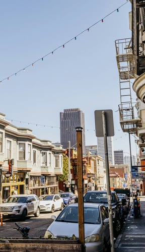 North Beach street in San Francisco with string lights and the Transamerica Pyramid in the distance